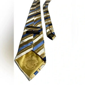 DONALD J TRUMP signature  collection striped silk gold and blue tie .